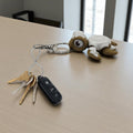 dolibarr:738:BCL-AC-KEY-TCIN-Cinnamon Roll Turtle Keychain SQ-Photoroom.jpg:sha256=83b8d940cb23